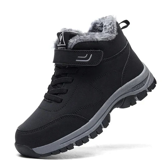 Black high-top boot with fleece-lined collar, hook-and-loop strap, laces and a gray lugged sole, angled side view 1