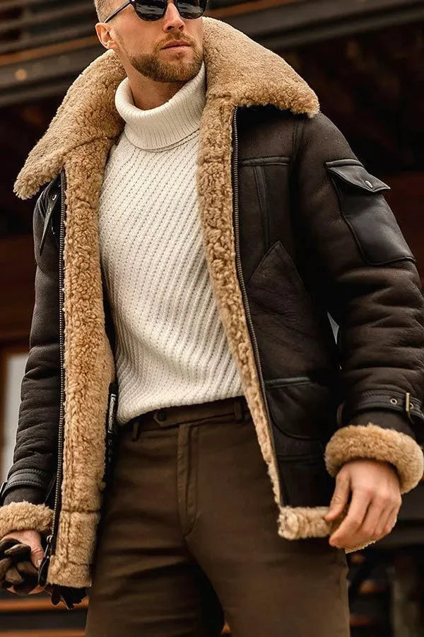 Dark brown version of the shearling jacket worn open over a cream turtleneck, with a fleece collar and cuffs 7