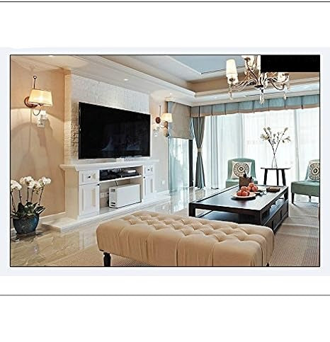 Wide view of a bright living room with a wall-mounted TV, tufted bench and coffee table 6