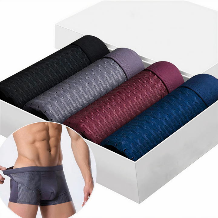 Four rolled boxer briefs in black, gray, burgundy and navy in a white box, with a worn inset 2