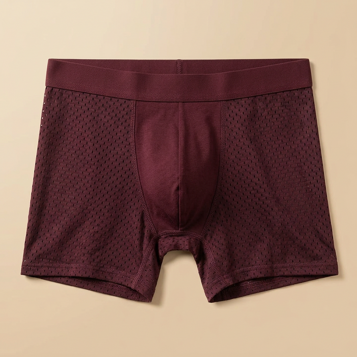 Burgundy boxer briefs laid flat, showing perforated mesh panels, stitched seams and a wide waistband 7