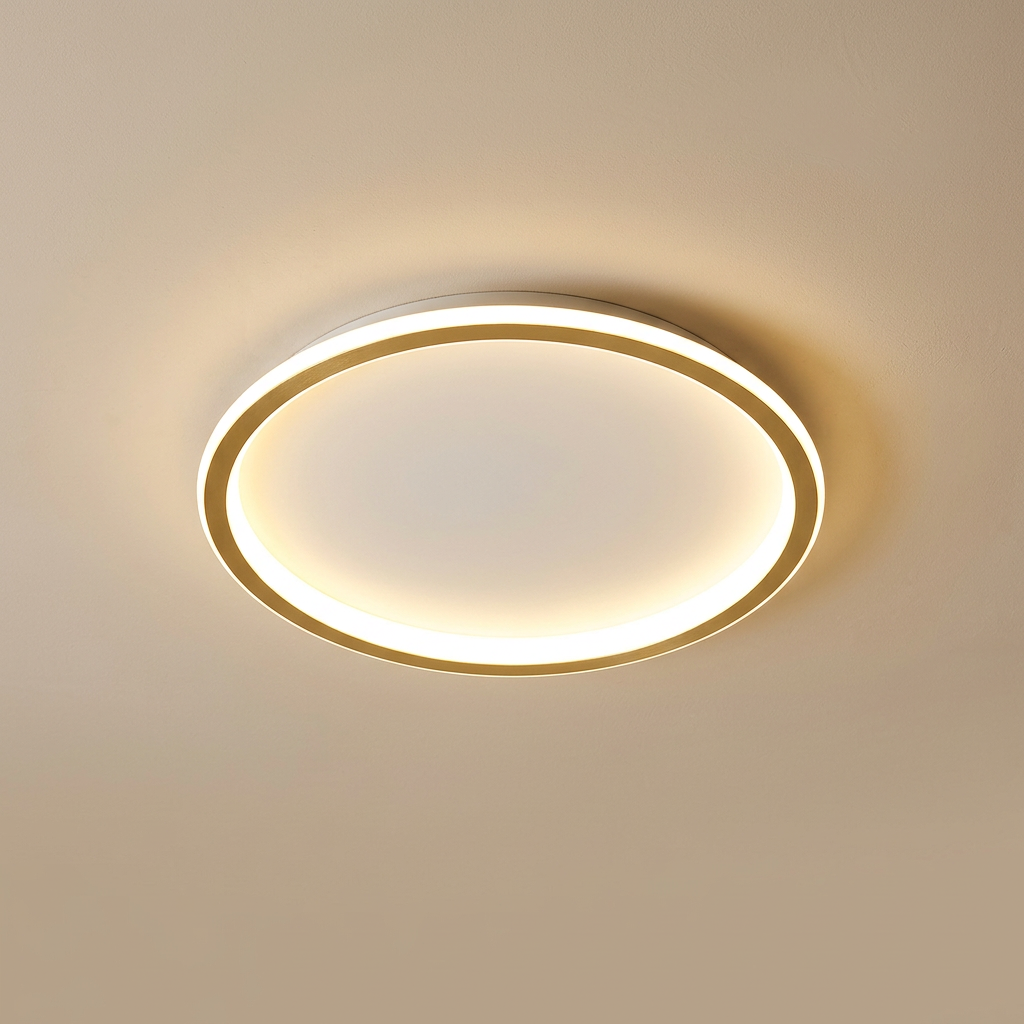 Round ceiling light with a gold-toned inner ring and white outer rim, lit warm on a beige ceiling 5