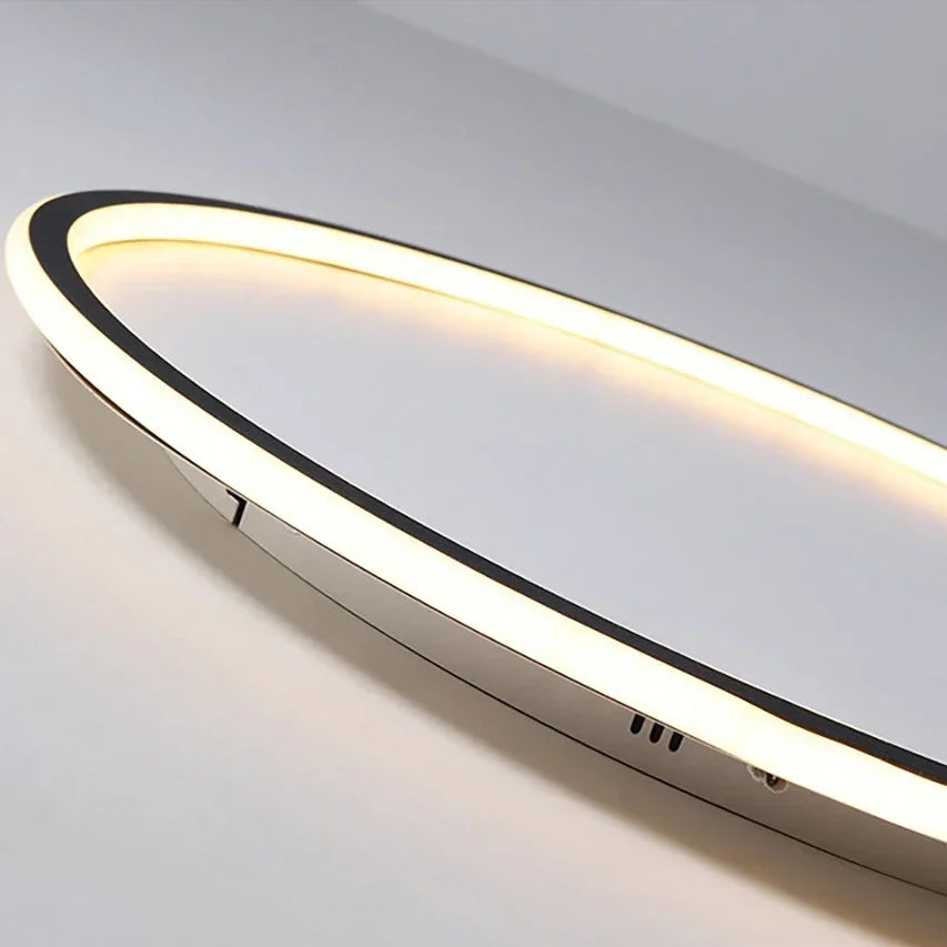 Close-up of the glowing ring's curved edge, showing the black trim and small underside openings 2