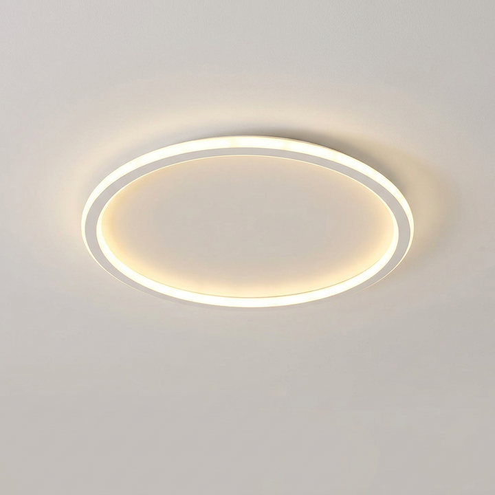 White-framed round ceiling light turned on, shown alone on a plain light ceiling 8