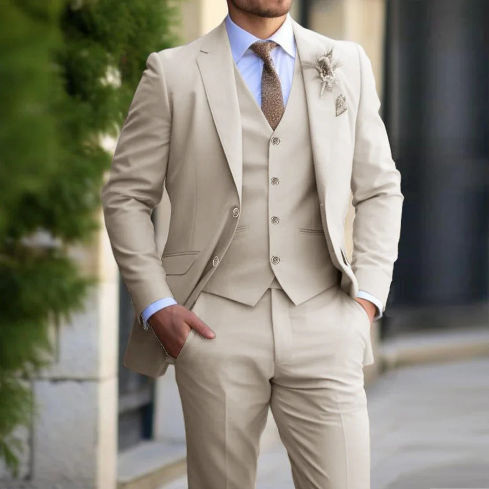 Beige three-piece suit with vest, light blue shirt and brown tie, worn outdoors with hand in pocket 2