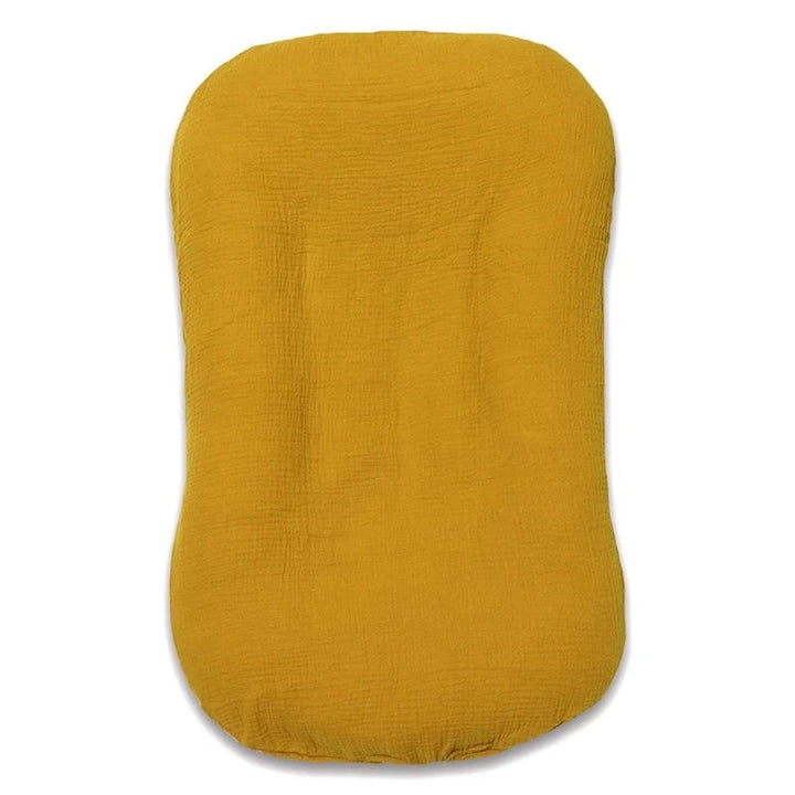 Empty mustard yellow muslin lounger shown from above on a white background 12