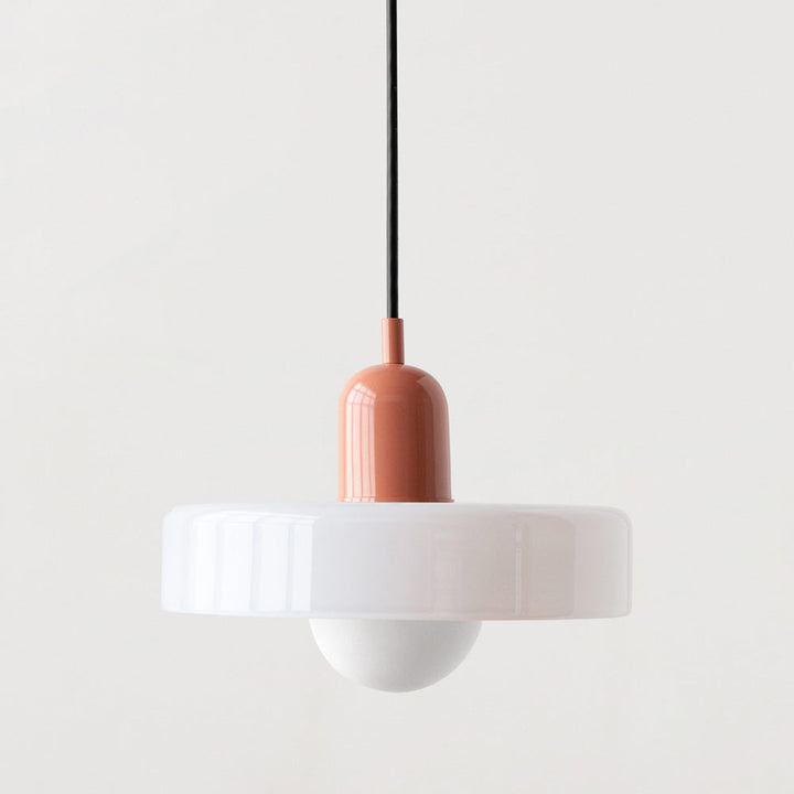 White glass shade with a glossy coral-pink cap, black cord and white globe bulb 40