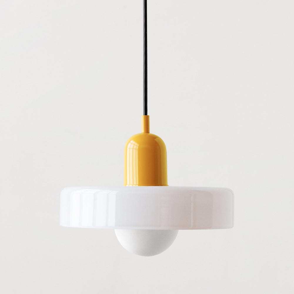 White glass disc pendant with a glossy yellow cap and black cord on a plain background 49