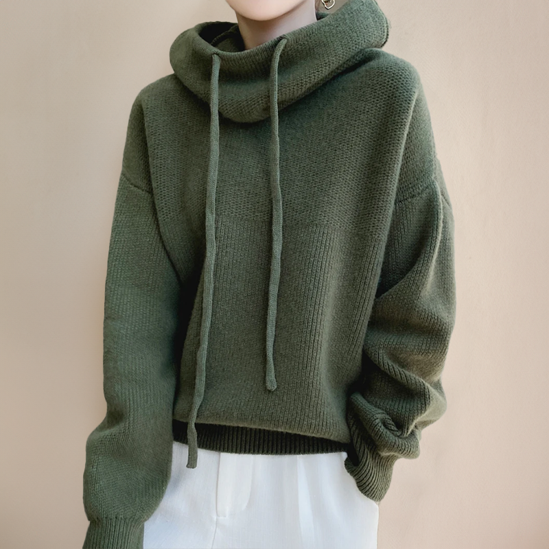 Olive green sweater worn with a slouchy cowl neck, long drawstrings and white pants 3