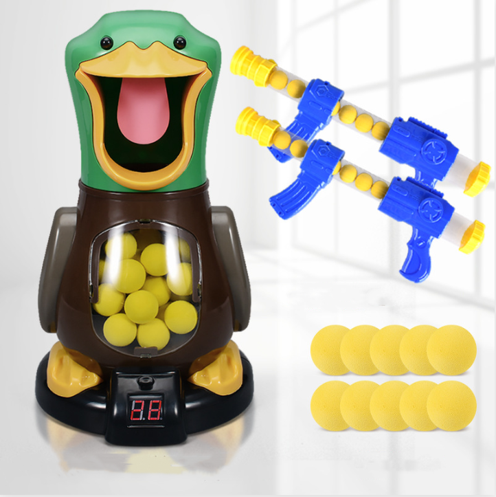 Duck target with digital score display, two blue blasters and ten yellow foam balls laid out 5