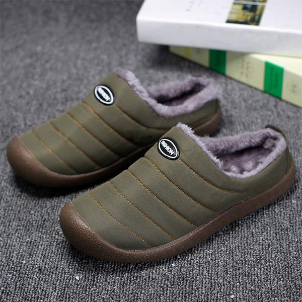 Olive green quilted slippers from a higher angle, showing the plush gray lining 3