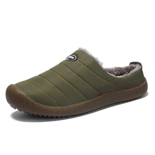 Single olive green quilted slipper on white background showing fleece lining and brown sole 14