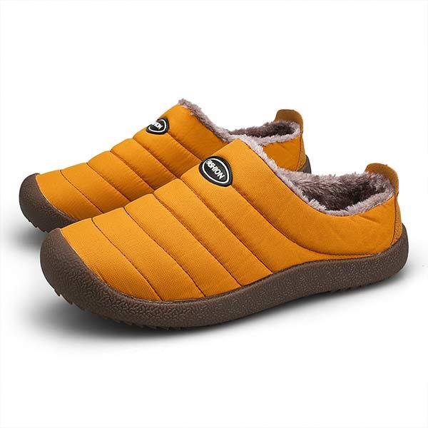 Pair of mustard orange quilted slippers on a white background, with brown fleece lining 11