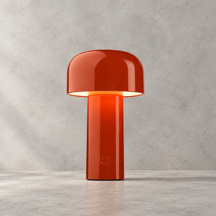 Glossy red lamp lit against a concrete-textured wall, button visible on the stem 29