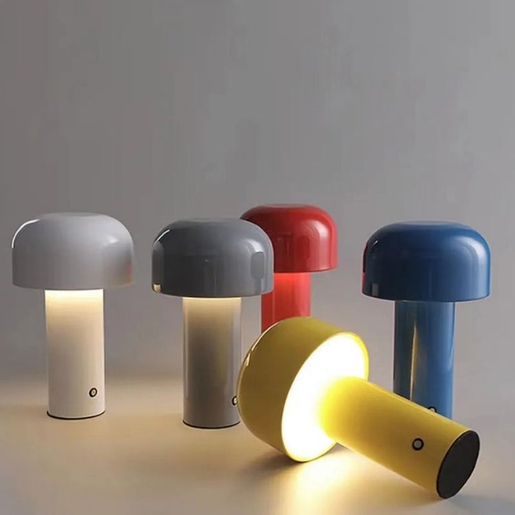 Five mushroom lamps in white, gray, red, blue and yellow, with the yellow one lying on its side, lit 17
