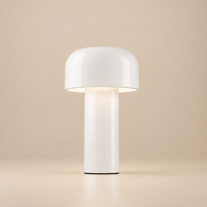 Glossy white mushroom lamp lit against a beige backdrop, with a round power button on the base 28