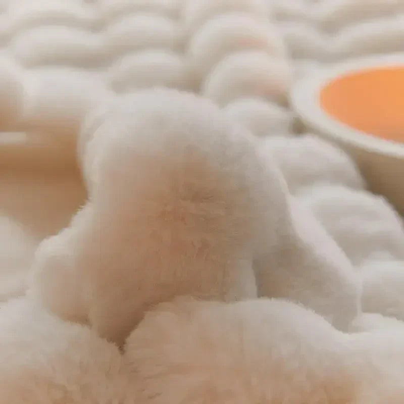 Extreme close-up of a soft, rounded cream plush bubble showing the dense, fluffy pile 9