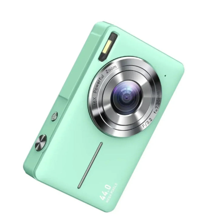 Mint green compact camera angled to show the front with silver lens ring, flash and buttons 2