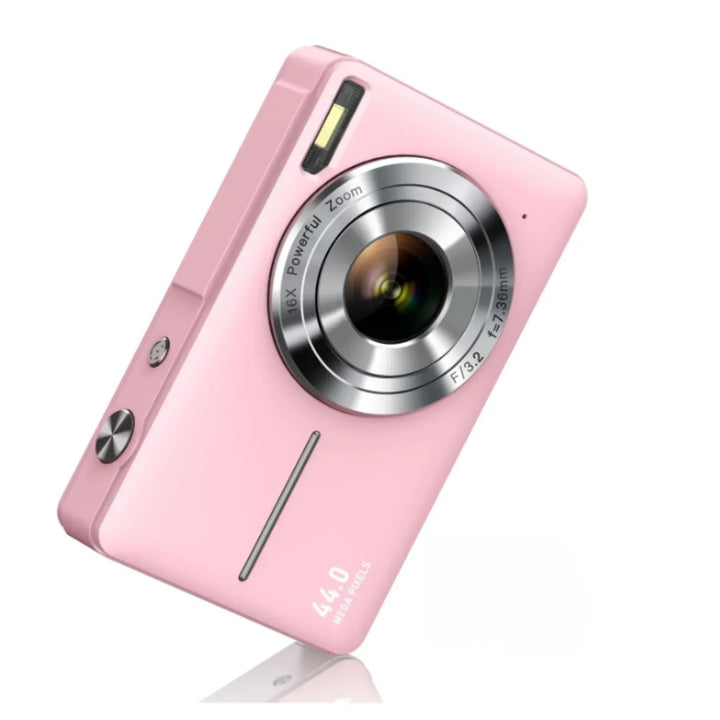 Pink compact camera angled to show the front with silver zoom lens ring and flash 6