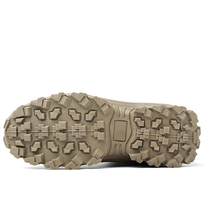 Sand-colored outsole seen from below, with a deep multi-directional lug pattern and center heel pad 13