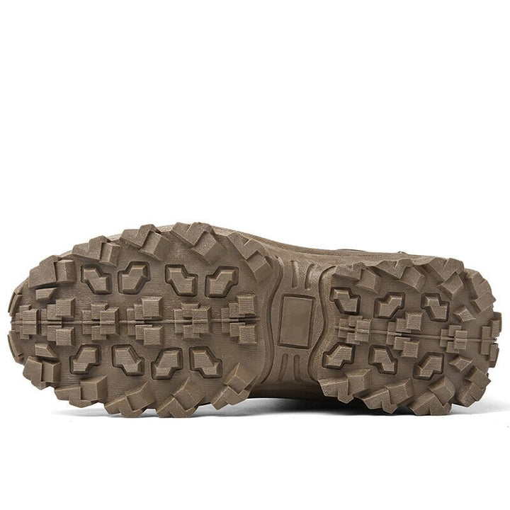 Brown outsole seen from below, showing the deep blocky lug pattern and center shank area 18