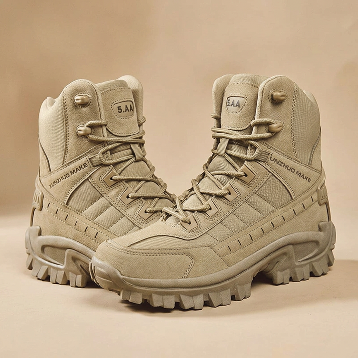 Pair of sand-colored high-top lace-up boots with suede and fabric panels, shown on a matching beige backdrop 24
