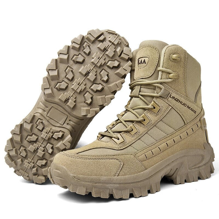 Tan boot stood next to a second boot tipped to show its patterned lug sole 9