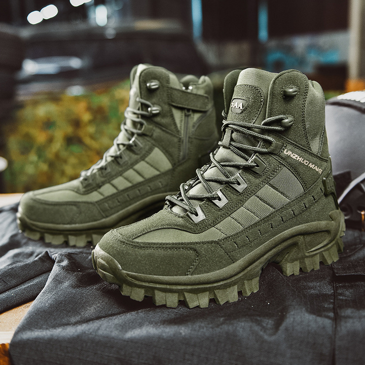 Olive green boots shown as a pair on a dark fabric surface, side zipper visible 7