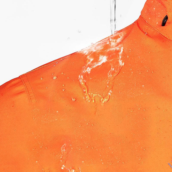 Water splashing and beading on the shoulder of an orange jacket, showing the waterproof fabric 4