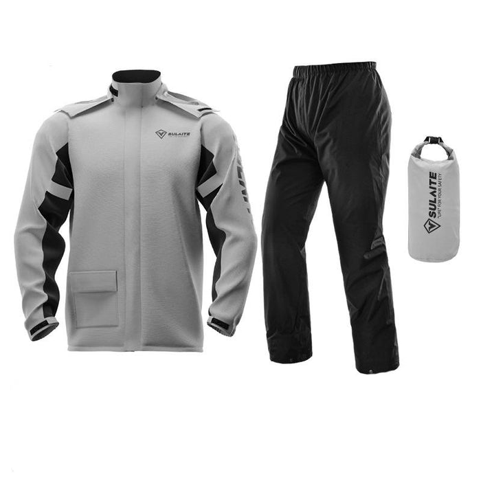 Light gray rain jacket with black panels, black pants and a matching gray dry bag laid out together 5