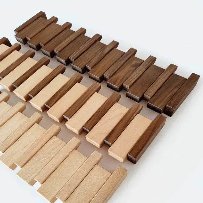 Loose wooden blocks in dark walnut and light natural tones laid out in rows 5