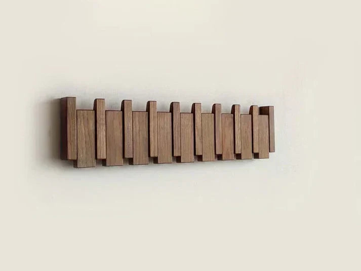 Dark brown wooden rack with all hooks folded flat, forming a staggered block pattern 9